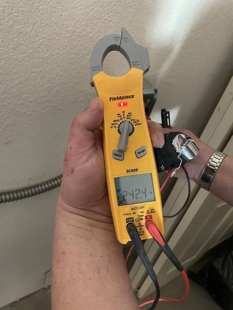 Voltage testing with clamp meter during Recessed Lighting Installation in Stow